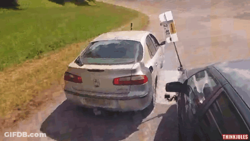 A White Car With A License Plate That Says 2 Nz GIF