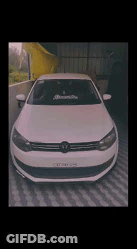 A White Car With A License Plate That Says K.e.o.s.m.p. GIF