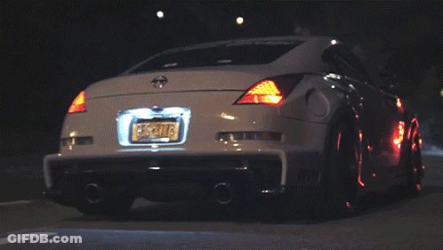 A White Car With A New York License Plate That Says Ecs-T078 GIF