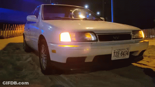 A White Car With A Virginia License Plate That Says Tze-8434 GIF