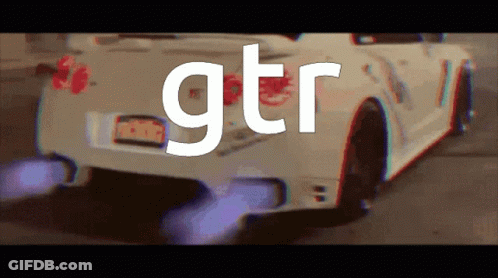 A White Car With Gtr Written On The Back GIF