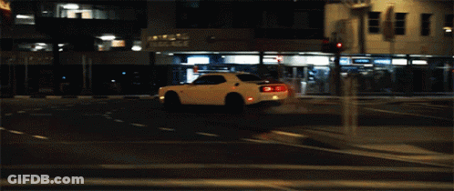 A White Car With The Letter C On The Tail Lights GIF