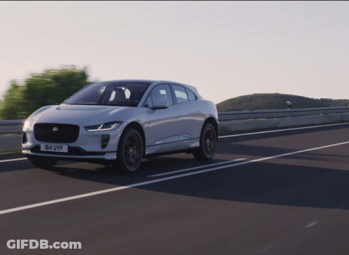 A White Car With The License Plate 164 Uyp Drives Down A Highway GIF