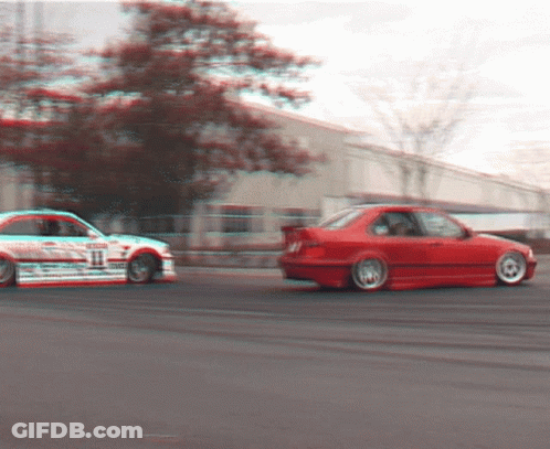 A White Car With The Number 11 On It Is Driving Next To A Red Car GIF
