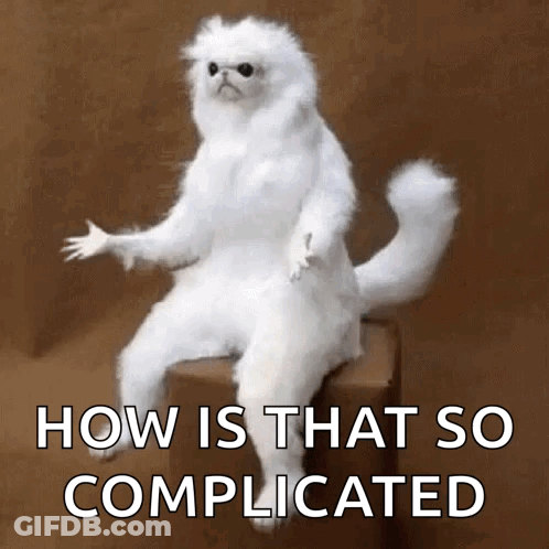 A White Cat Is Sitting On A Box With The Words How Is That So Complicated Above It GIF