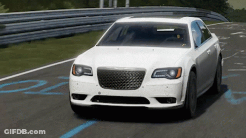 A White Chrysler Car Is Driving On A Road GIF