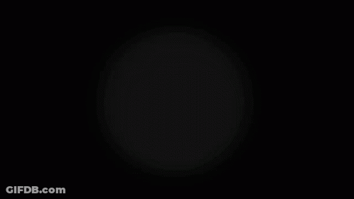 A White Circle Is Surrounded By A Gray Circle On A Black Background GIF