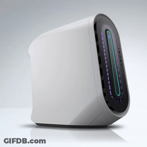 A White Computer Sitting On A Table With A Blue Light On The Front GIF