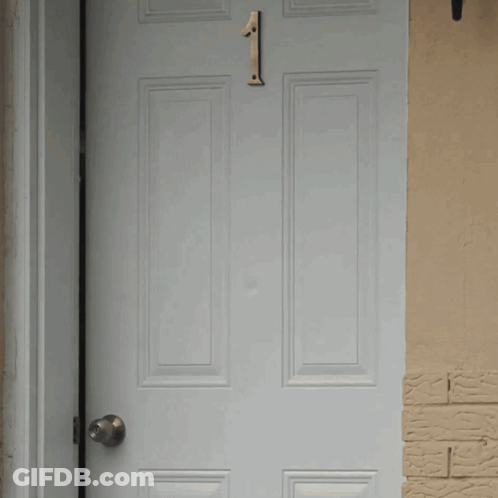 A White Door With A Number 1 On It GIF