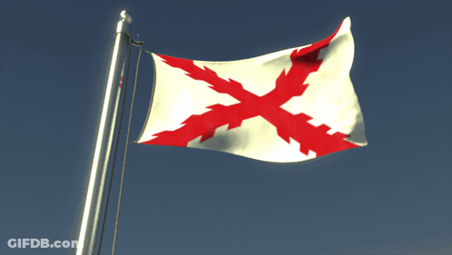 A White Flag With A Red Cross On It Is Flying In The Wind GIF