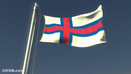 A White Flag With A Red Cross On It GIF