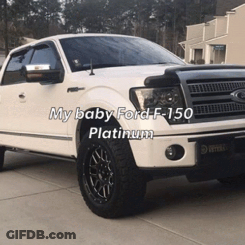 A White Ford F-150 Is Parked In A Driveway With The Caption My Baby Ford F-150 Platinum GIF