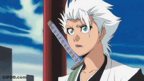 A White Haired Anime Character Holding A Sword In His Mouth GIF