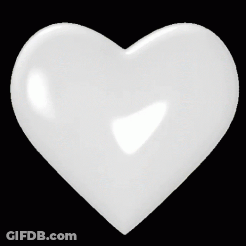 A White Heart On A Black Background With A Light Coming Out Of It GIF