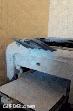 A White Hp Printer Is Sitting On A Table GIF