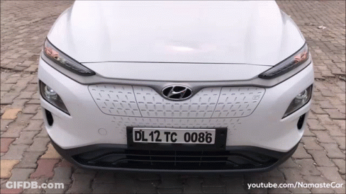 A White Hyundai Car Has A License Plate That Says Dl12tc 0086 GIF