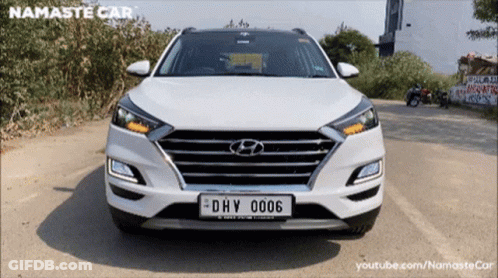 A White Hyundai With A License Plate That Says Dhv 006 GIF