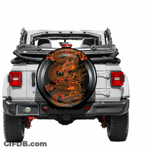 A White Jeep With A Tire Cover With A Dragon Design On It GIF