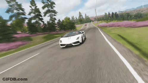 A White Lamborghini Is Driving Down A Road GIF
