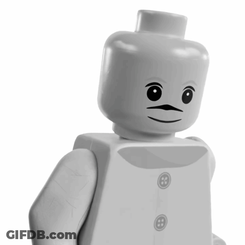 White Lego Figure With Chest Button GIF