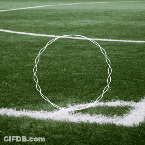 A White Line On A Soccer Field With A Circle Drawn In The Middle GIF