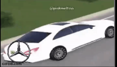 A White Mercedes Is Driving Down The Road GIF
