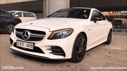 A White Mercedes With A License Plate That Reads Dl 10Tc 0059 GIF