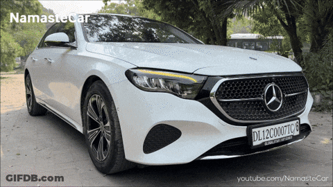 A White Mercedes With A License Plate That Says Dl12c0007tc GIF