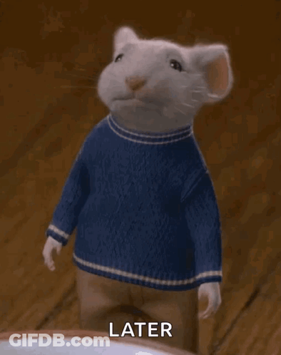 A White Mouse Wearing A Blue Sweater And Pants Is Waving . GIF