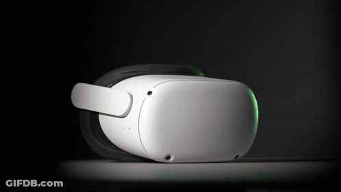 A White Oculus Virtual Reality Headset With A Green Light On It GIF