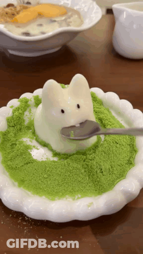 A White Plate With A Bunny On It And A Spoon On Top Of It GIF