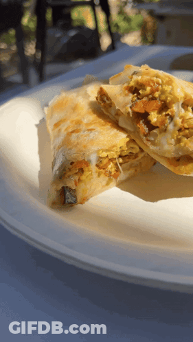 A White Plate With A Sandwich On It GIF