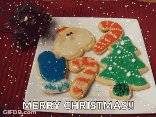 A White Plate With Christmas Cookies On It And The Words Merry Christmas GIF