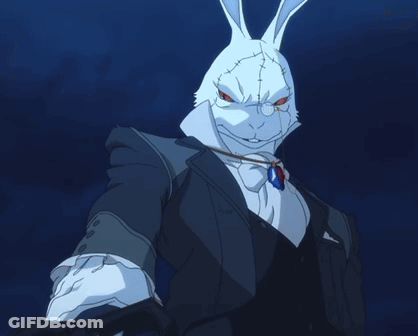 A White Rabbit Wearing A Suit And Tie With A Blue Necklace GIF