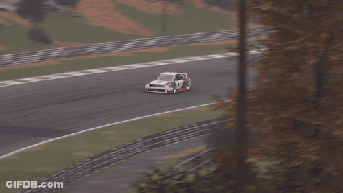A White Race Car With The Number 4 On The Side GIF