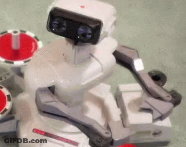 A White Robot With A Red Button On Its Head That Says ' Nintendo ' GIF
