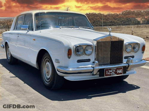 A White Rolls Royce With A License Plate That Reads 1252 H4 GIF