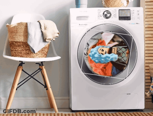 A White Samsung Washing Machine With Clothes Inside GIF