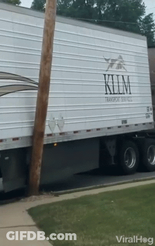 A White Semi Truck With The Word Klim On It GIF
