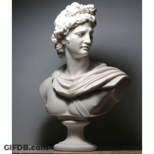 A White Statue Of A Man With A Shawl Around His Neck GIF