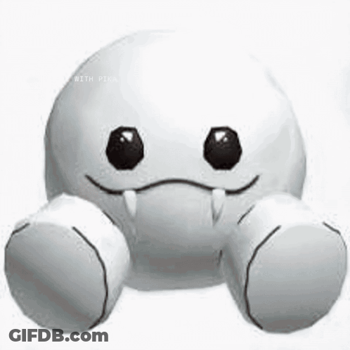 A White Stuffed Animal With Black Eyes And Teeth Is Smiling . GIF
