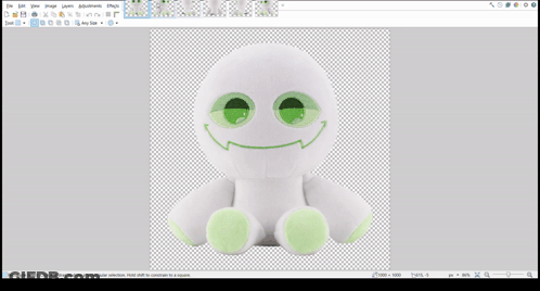 A White Stuffed Animal With Green Eyes And A Smiley Face GIF
