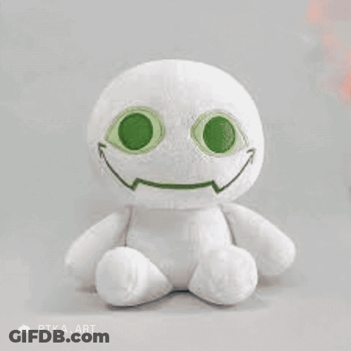 A White Stuffed Animal With Green Eyes Is Being Held By A Person With Black Nail Polish GIF