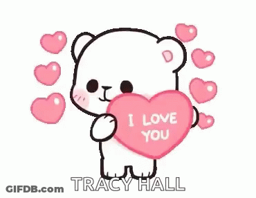 A White Teddy Bear Is Holding A Pink Heart That Says `` I Love You '' . GIF