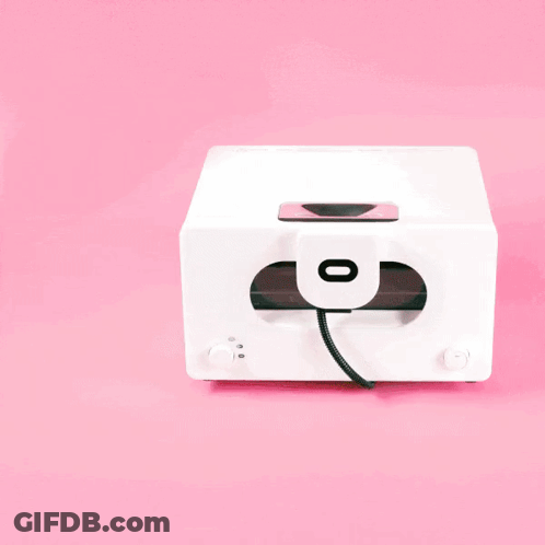 A White Toaster Oven With A Tray Of Cookies Inside GIF