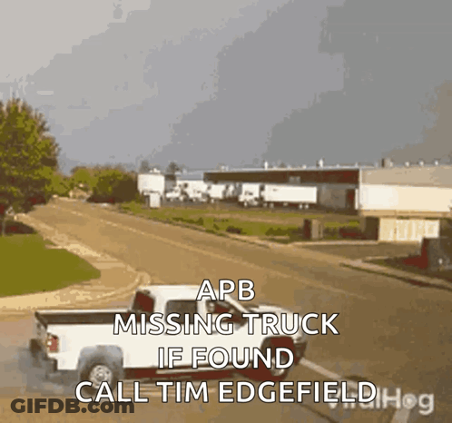 A White Truck Is Driving Down A Street With The Words " Apb Missing Truck If Found Call Tim Edgefield " GIF