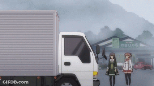 A White Truck Is Parked In Front Of A Building With A Sign That Says " Store " On It GIF