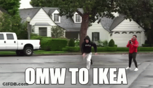 A White Truck Is Parked In Front Of A House With The Words Omw To Ikea Written On The Road GIF