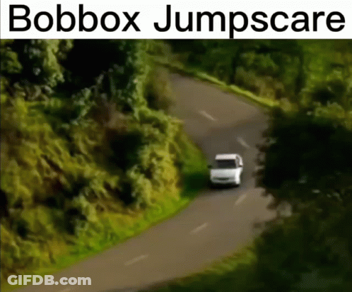 A White Van Is Driving Down A Road With The Words Bobbox Jumpscare Written Above It GIF