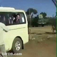 A White Van Is Parked On The Side Of A Road GIF